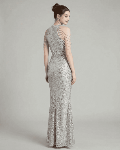 Luxe Maxi Dress by SLIMONA featuring silver sequin fabric and elegant halter design, showcasing a stunning mermaid silhouette.