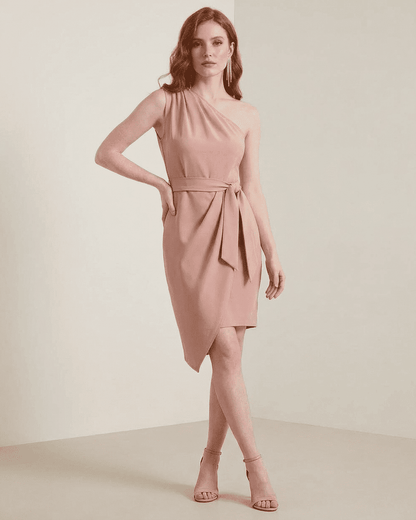 Lyra Mini Dress by SLIMONA in soft pink, showcasing a one-shoulder satin design with an asymmetrical hem.