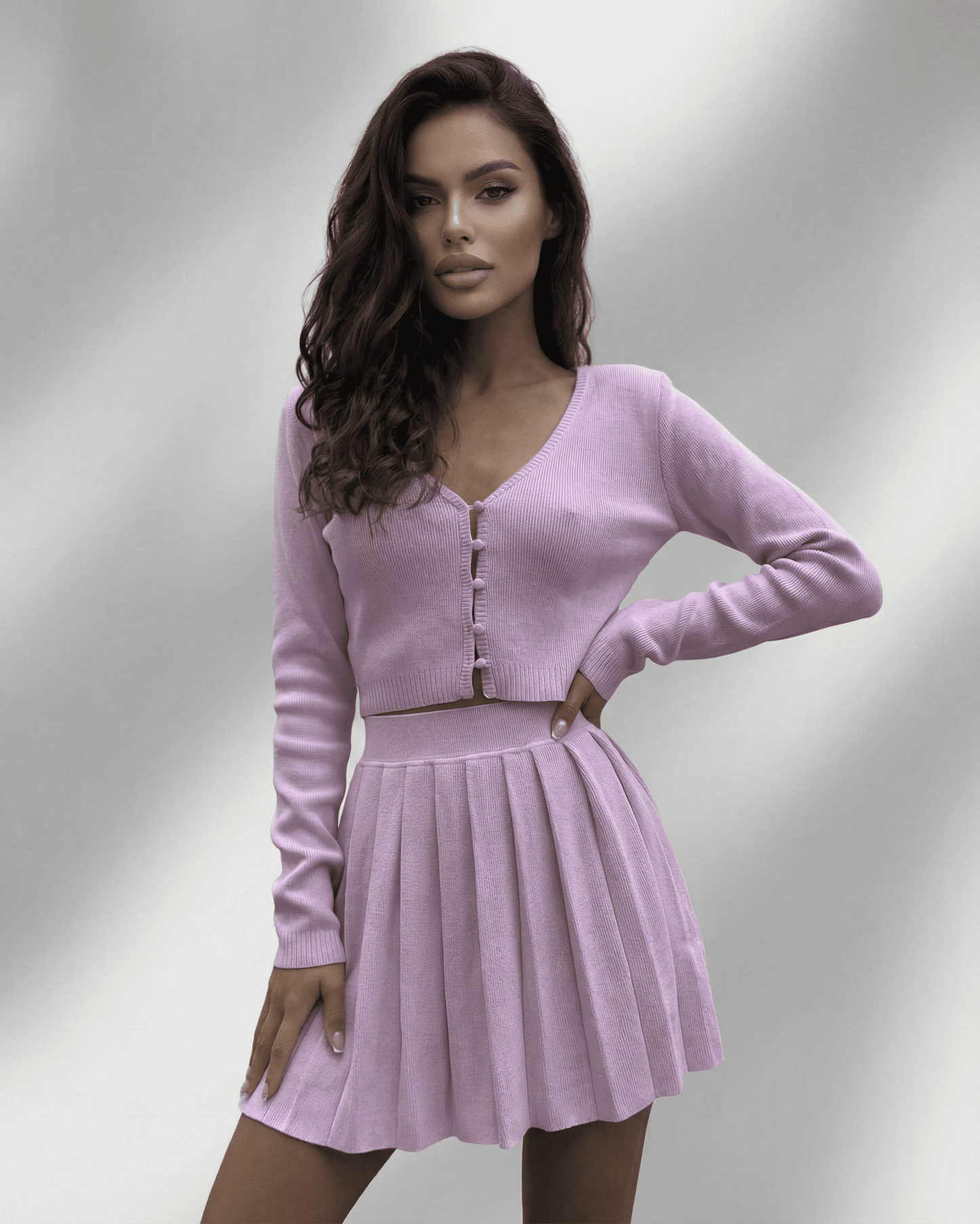 Lyra Two-Piece Set by SLIMONA featuring a soft knit cardigan and a pleated mini skirt in lavender color.