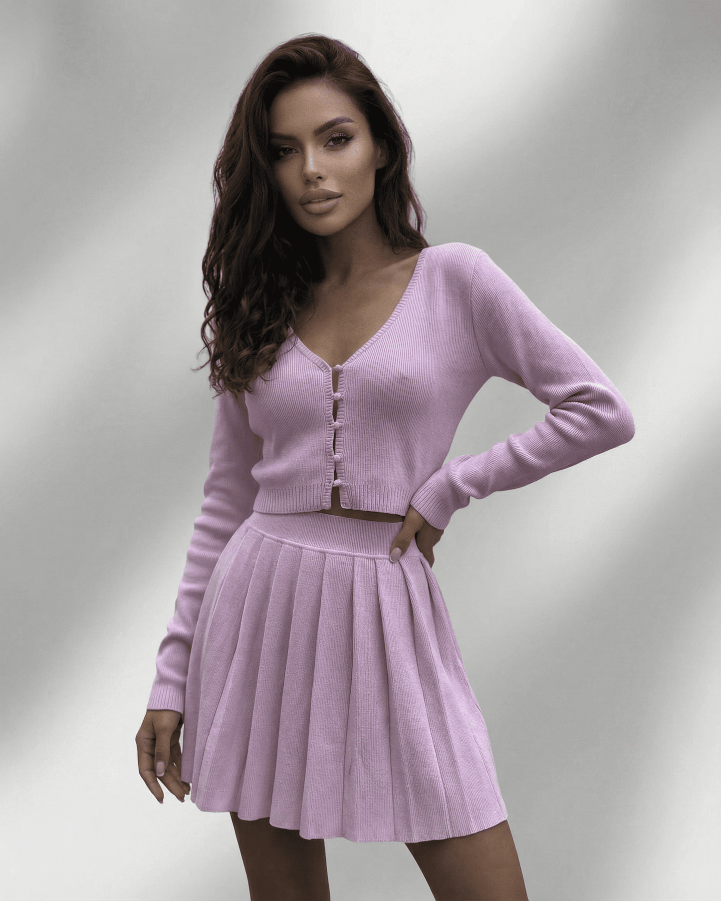 Lyra Two-Piece Set by SLIMONA featuring a soft knit cardigan and pleated mini skirt in light purple.