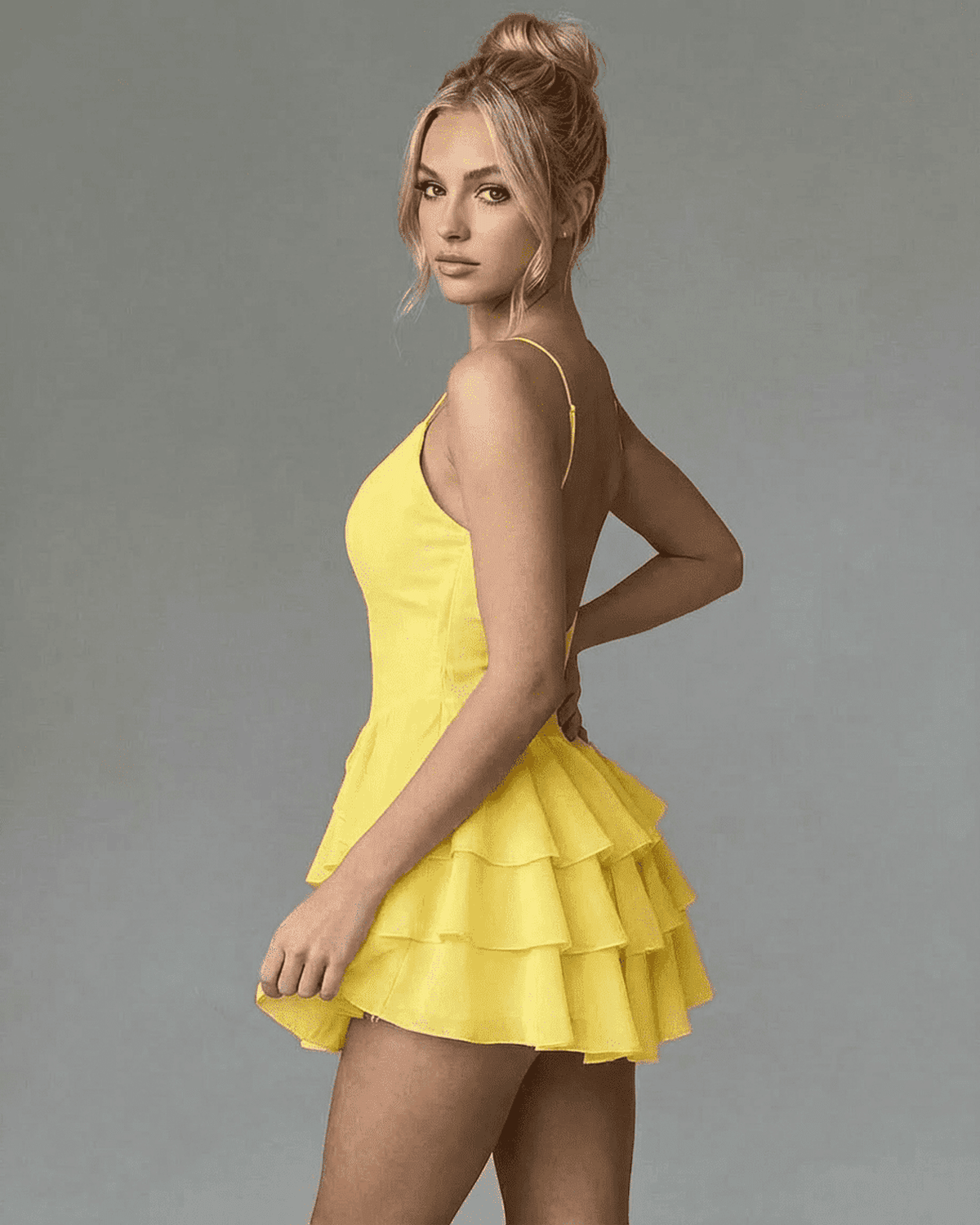 SLIMONA Marigold Mini Dress in vibrant yellow, featuring spaghetti straps and a tiered ruffle skirt for a stylish look.