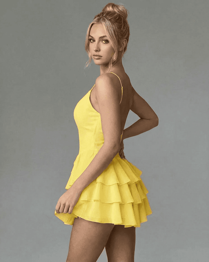 SLIMONA Marigold Mini Dress in vibrant yellow, featuring spaghetti straps and a tiered ruffle skirt for a stylish look.