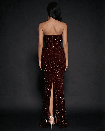 Back view of the Marquise Maxi Dress by SLIMONA featuring sequins, a dramatic thigh-high slit and strapless design.