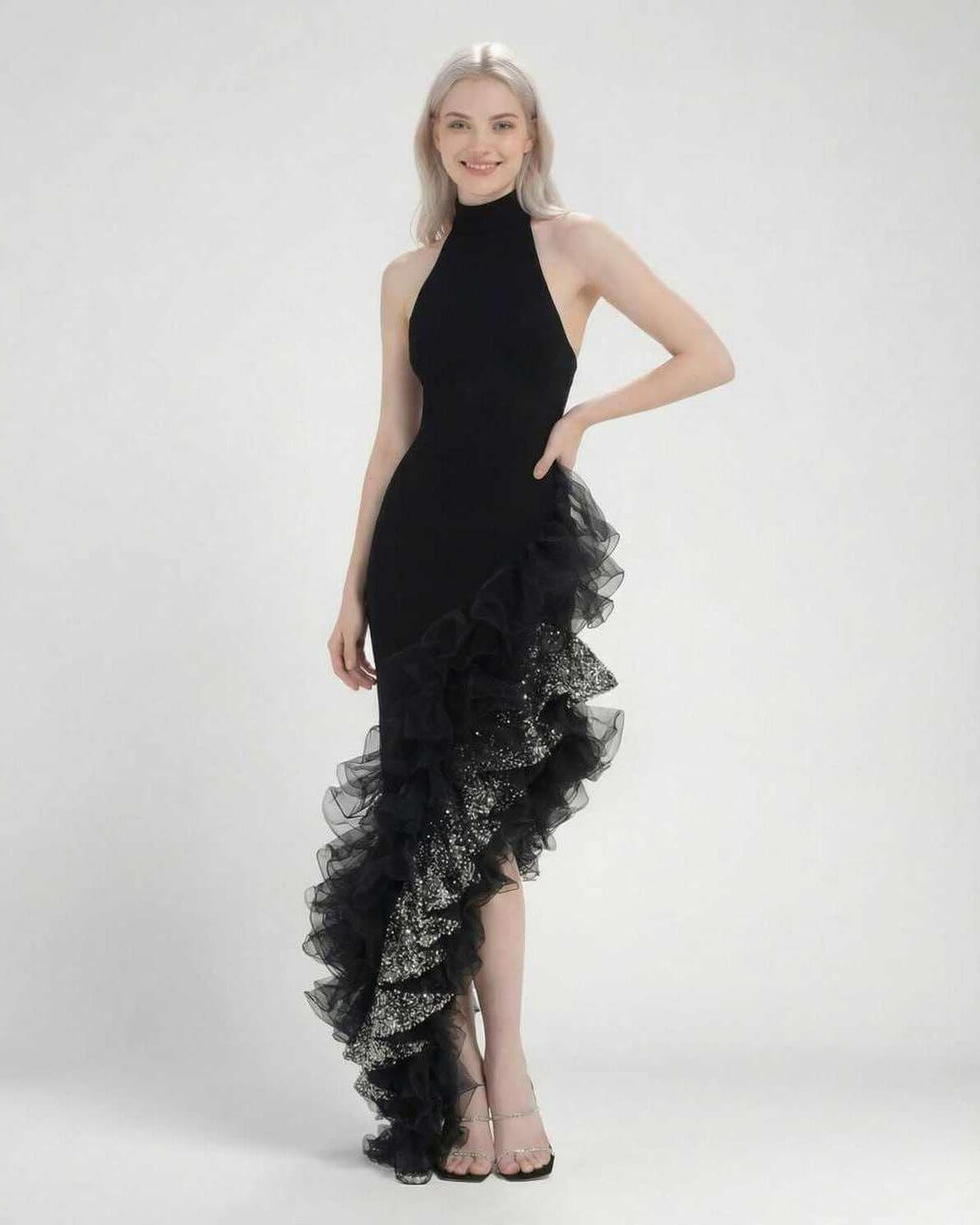 Monaco Maxi Dress by Lauven, a chic black halter neck dress with asymmetrical ruffle detail.