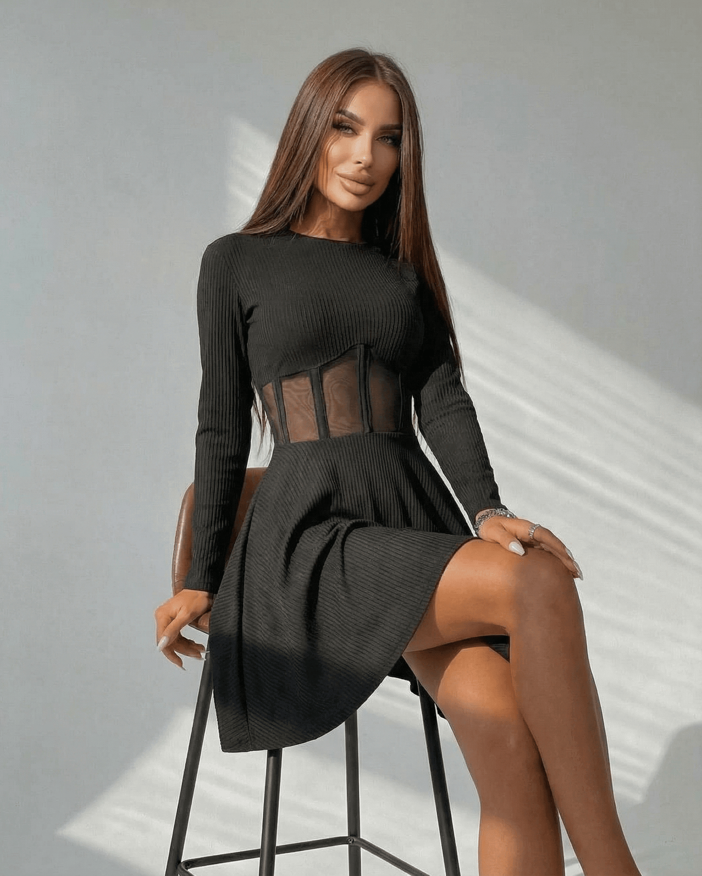 Monaco Mini Dress by Lauven, a black long sleeve A-line mini dress featuring a sheer corset panel and stylish silhouette.