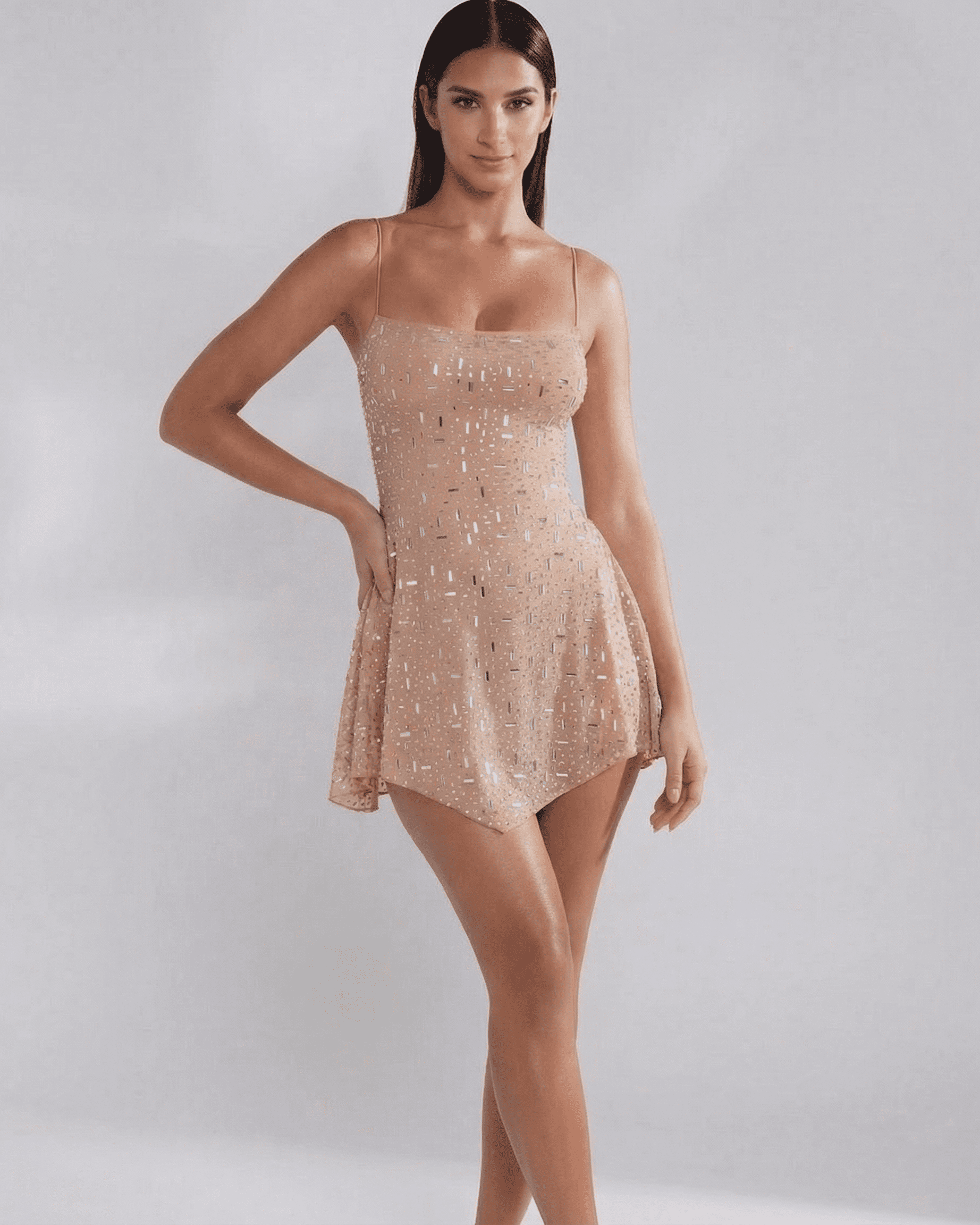 Monaco Mini Dress by SLIMONA, embellished mermaid-style mini dress in soft nude with square neckline and spaghetti straps.