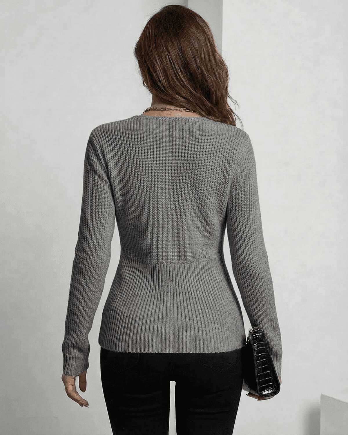 back view of Nerina Pullover by SLIMONA, a sophisticated ribbed slim fit V-neck sweater in elegant grey.