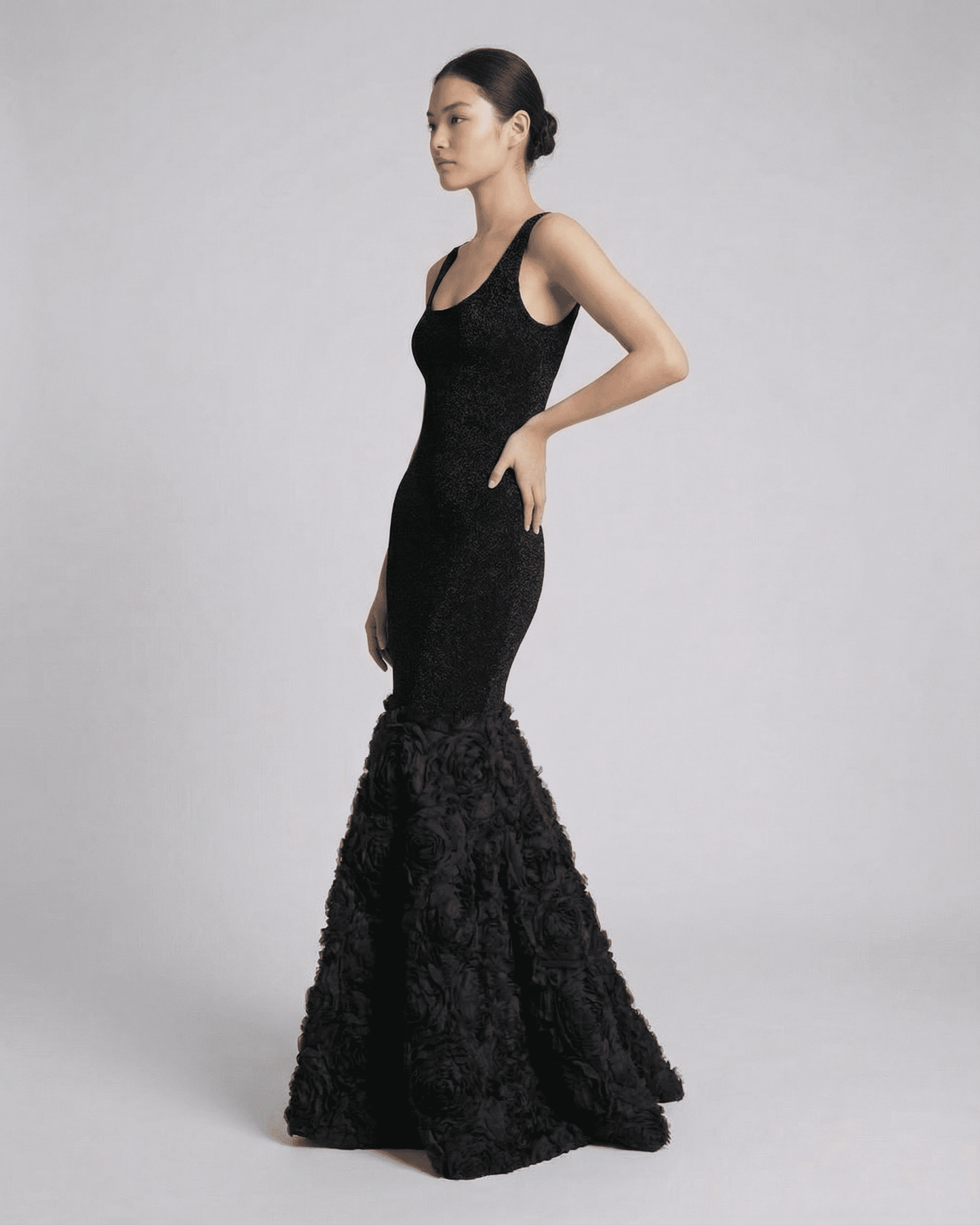 Nocturne Maxi Dress by SLIMONA featuring a sculpted silhouette and textured hem detail in elegant black.