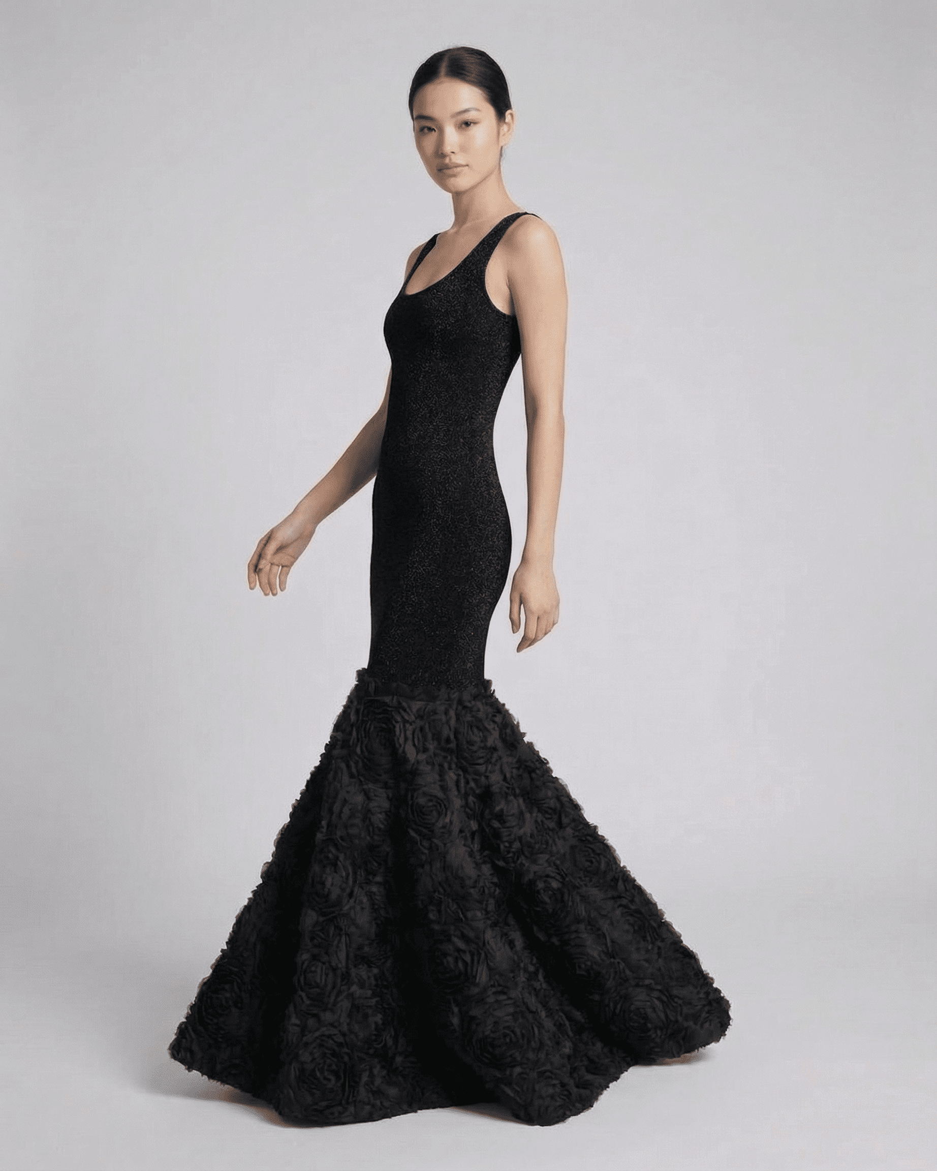 Nocturne Maxi Dress by SLIMONA featuring sculpted black silhouette with textured hem detail.