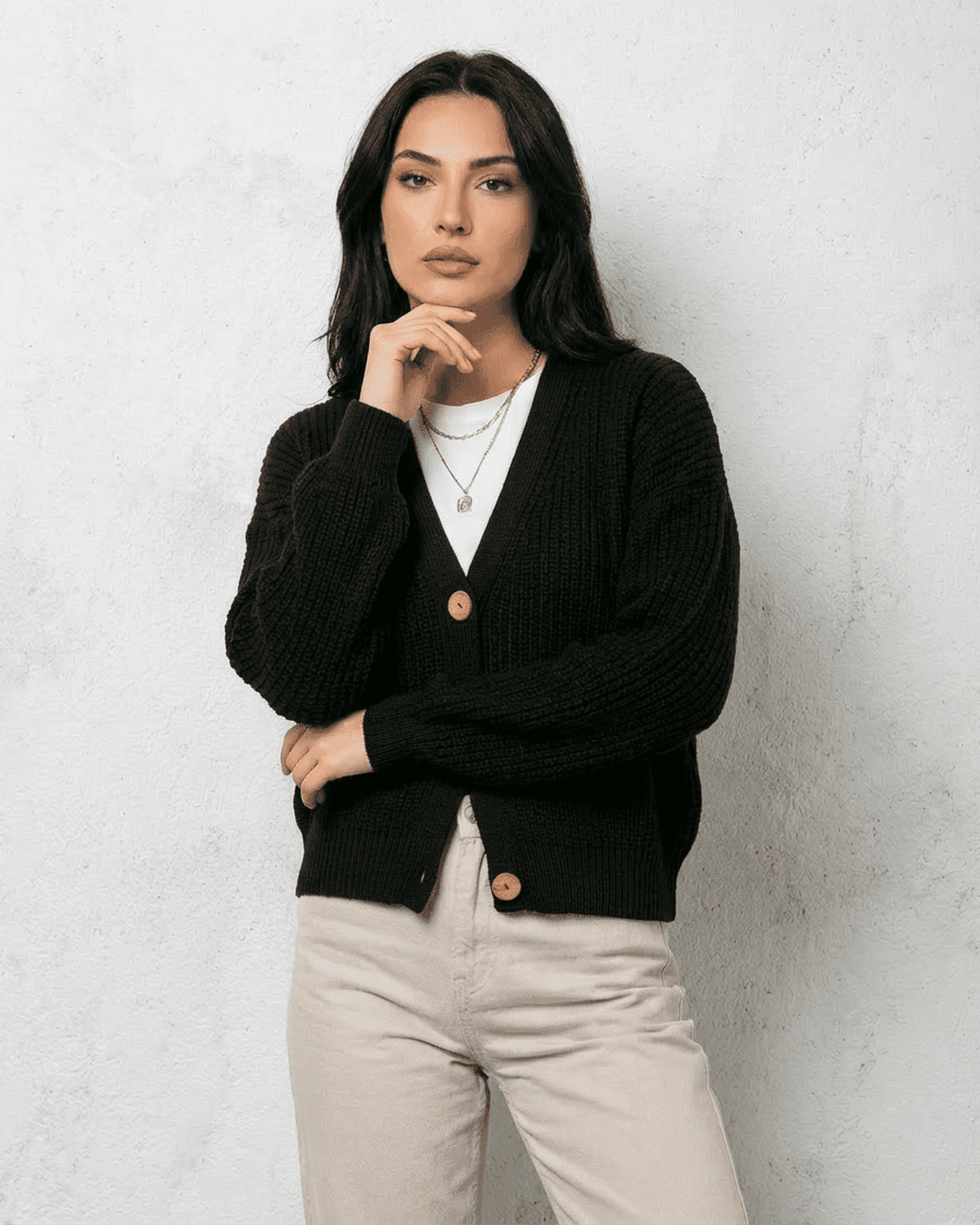 Noir Cardigan by SLIMONA - Sleek black knitwear featuring a classic V-neck and button detail, perfect for elegant fall outfits.