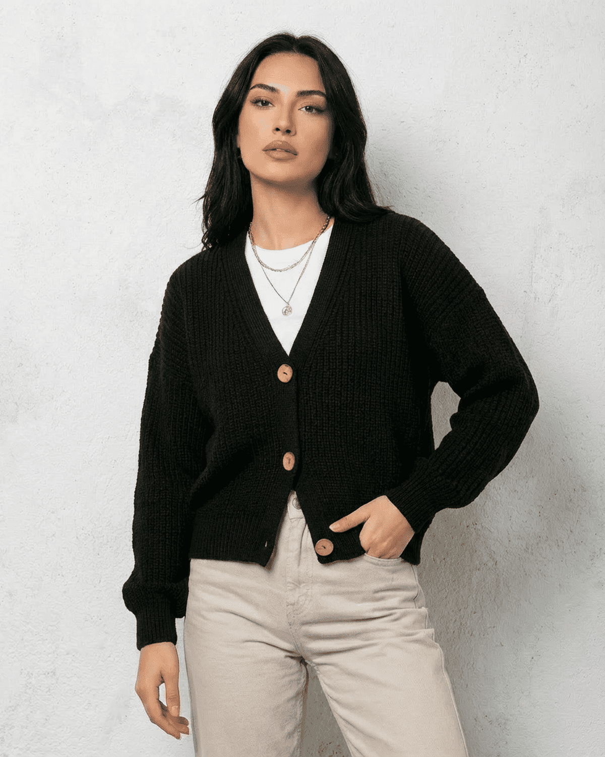 Noir Cardigan by SLIMONA - Sleek black knitwear with V-neck and button detail, perfect for fall and winter.
