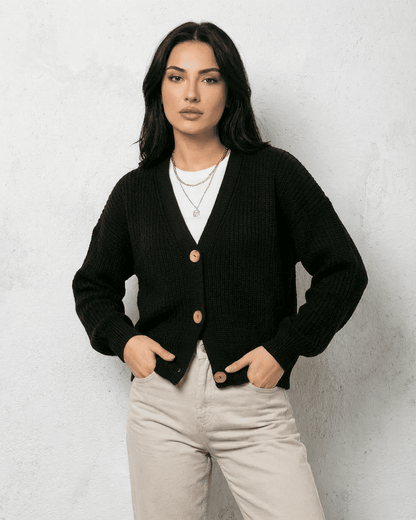 Noir Cardigan from SLIMONA - Stylish black knitwear with V-neck and button detail for a chic look.