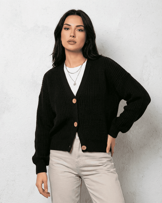 Noir Cardigan by SLIMONA – Cozy black knitwear with a classic V-neck and button detail.