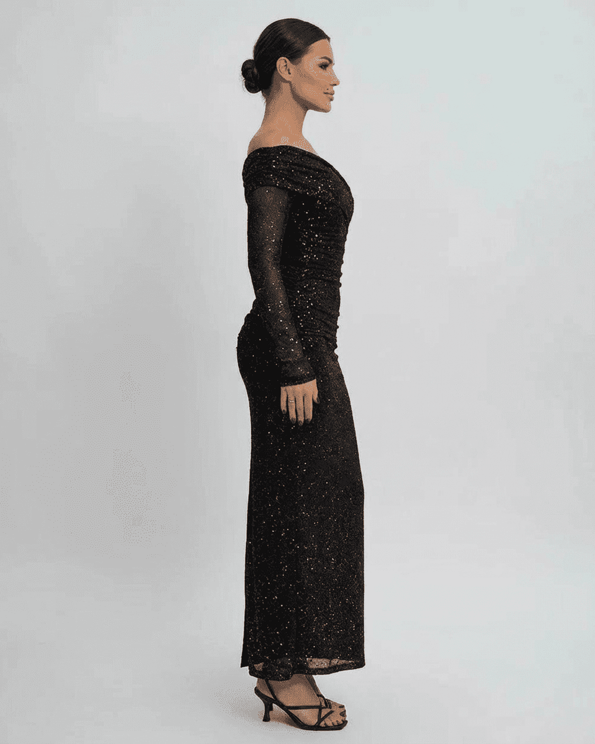 Noir Maxi Dress by SLIMONA, elegant off-the-shoulder mesh gown with sequins, showcasing a flattering silhouette.