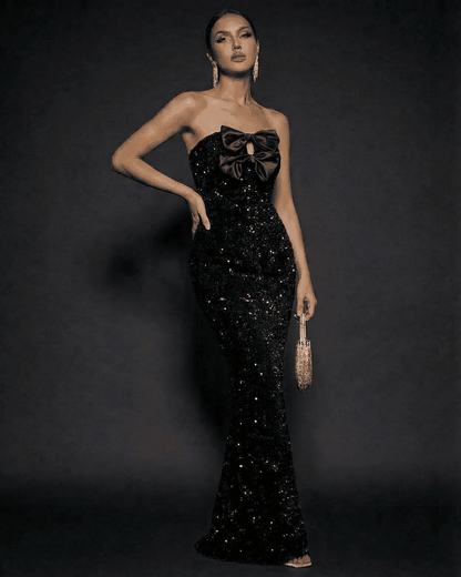 Noir Maxi Dress by SLIMONA, elegant strapless sequin gown with satin bow detail, perfect for formal events.