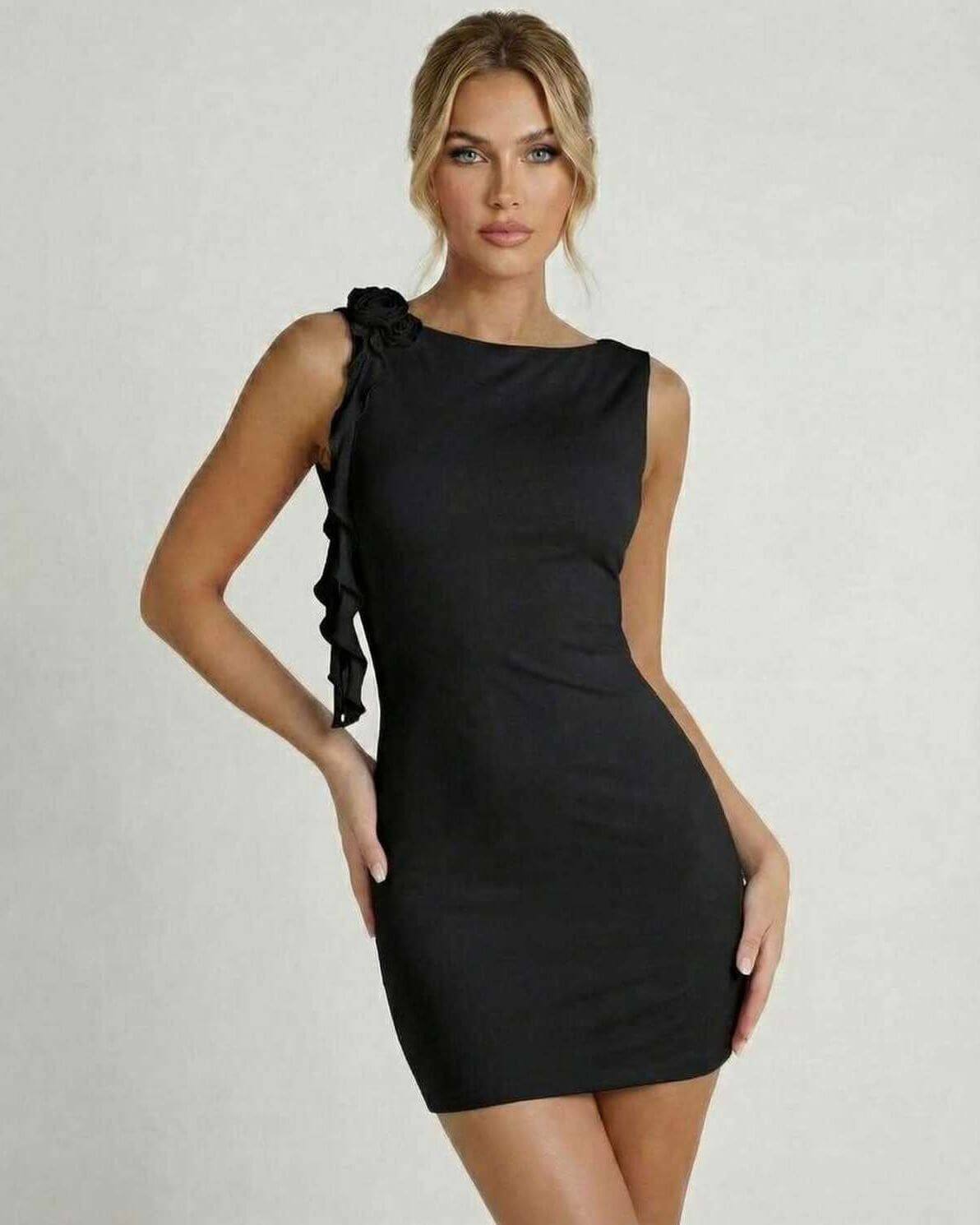 Noir Mini Dress by Lauven, classic black sleeveless bodycon with ruffle detail, elegant pencil silhouette.