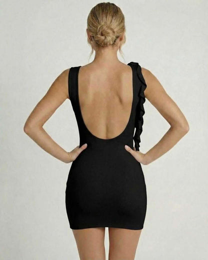 Noir Mini Dress by Lauven — Back view of a classic black sleeveless bodycon with ruffle detail.