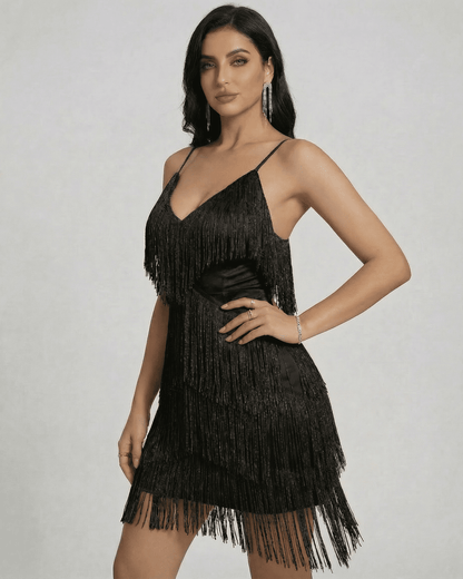 Noir Mini Dress by SLIMONA featuring layered fringe detail and sleek V-neck silhouette.