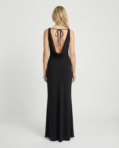 Noiré Maxi Dress by SLIMONA showcasing a sleek back view with a cowl neckline and elegant flow in a timeless design.