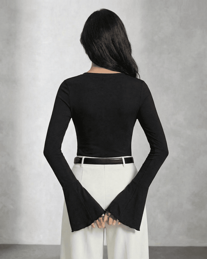 Back view of a model wearing the SLIMONA Nova Blouse featuring elegant flare sleeves and a slim fit design.