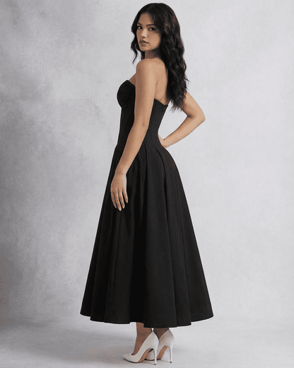 Nova Midi Dress by SLIMONA – Elegant strapless corset A-line dress in black, showcasing a flowing maxi skirt.