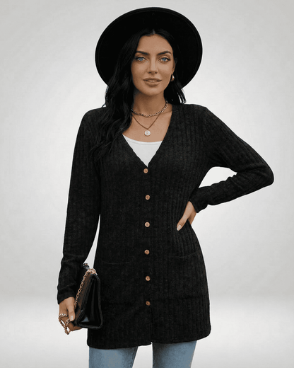 Stylish woman wearing Nyx Cardigan by SLIMONA, featuring a longline design and button-front knitwear.