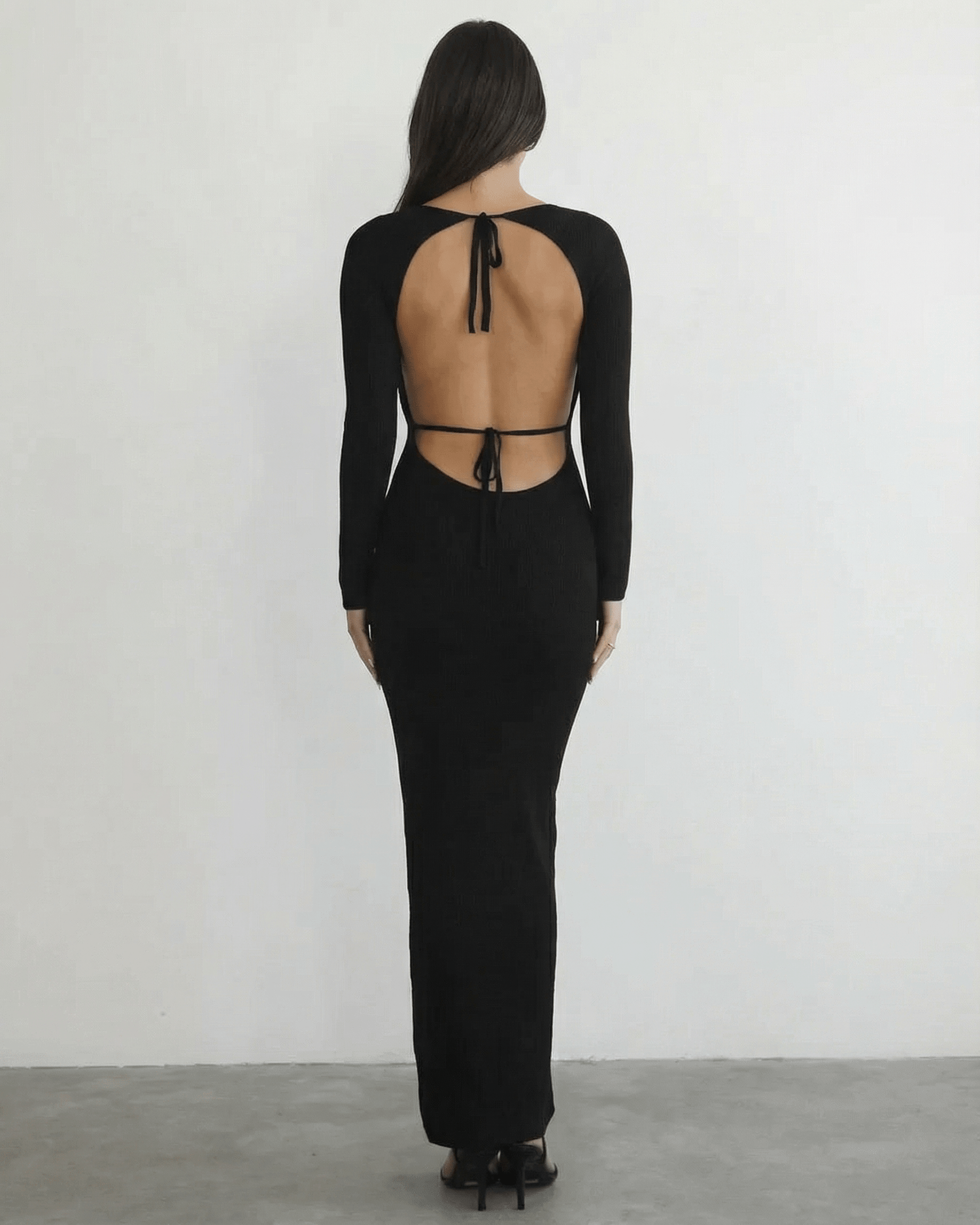 Nyx Maxi Dress from Lauven, showcasing the elegant back detail and long sleeve design.