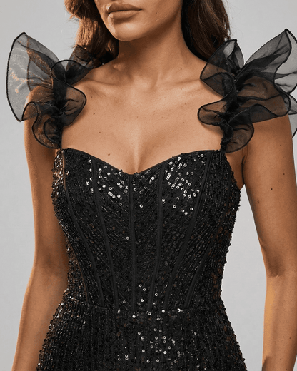 Obsidian Mini Dress by SLIMONA featuring black sequin off-the-shoulder design with ruffle sleeves.