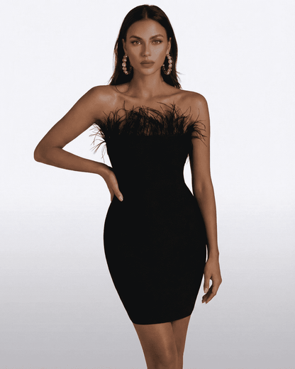 Onyx Mini Dress – SLIMONA strapless black feather-trimmed bodycon mini dress showcasing elegance and style.