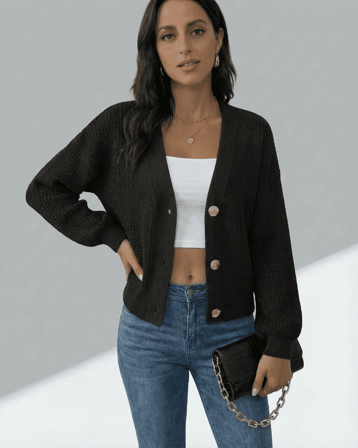 Orion Cardigan by SLIMONA featuring a modern V-neck design and button front, styled over a basic tank top.