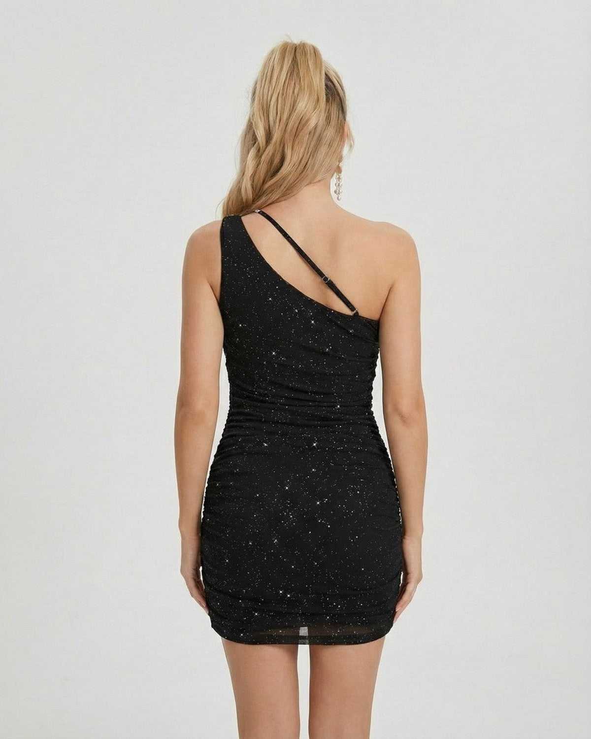 Orion Mini Dress by SLIMONA, featuring asymmetrical one-shoulder design and shimmering sequin detailing.