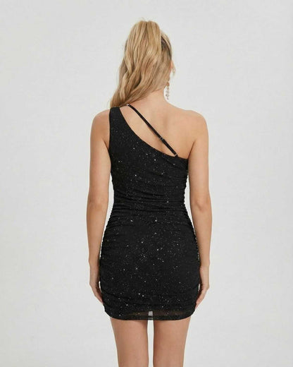 Orion Mini Dress by SLIMONA, featuring asymmetrical one-shoulder design and shimmering sequin detailing.