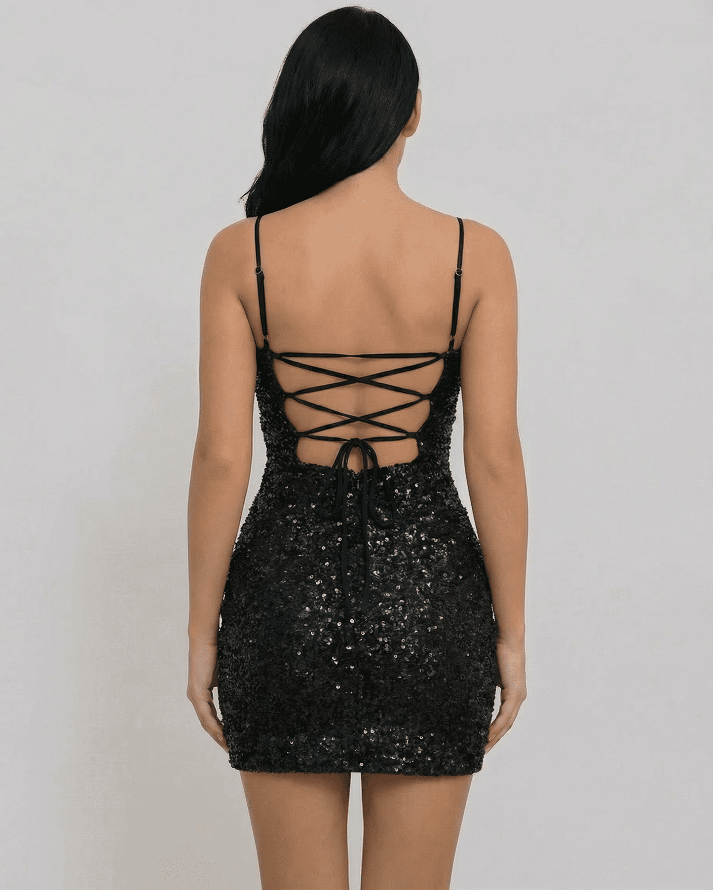 Orion Mini Dress by SLIMONA, showcasing a black sequin fabric with a stylish lace-up back design.