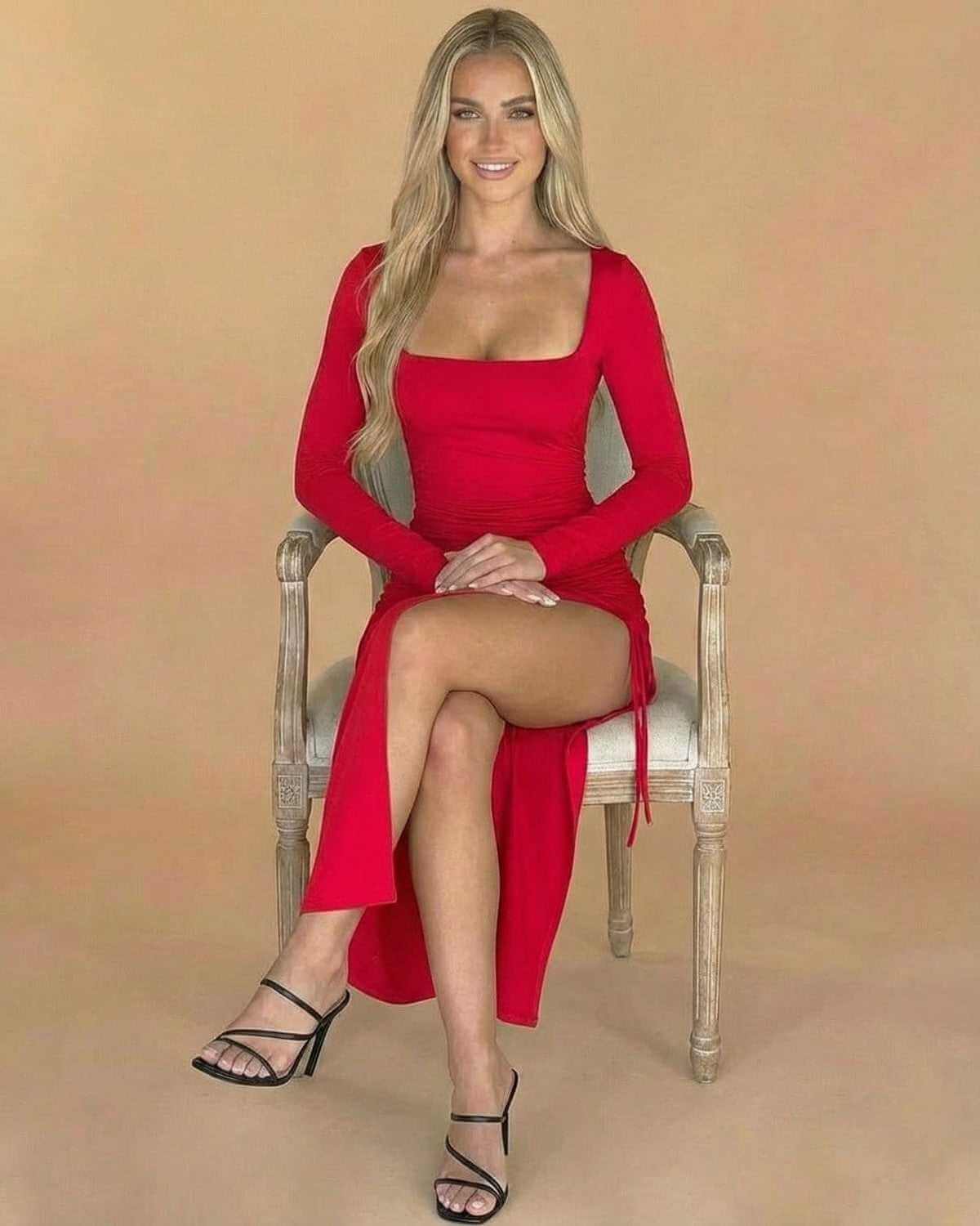 Model wearing Ravenna Midi Dress by SLIMONA, showcasing a square neck, long sleeves, and a stunning red bodycon fit.