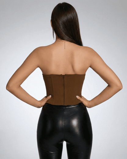 Back view of a woman wearing a Ruby Corset Top by SLIMONA, showcasing its elegant strapless design and structured fit.