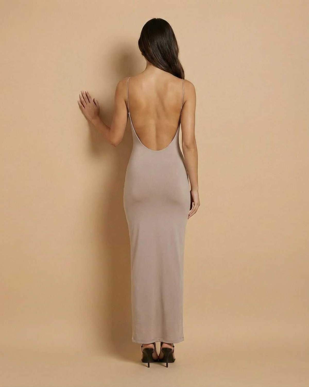 Sahara Maxi Dress by SLIMONA - Taupe backless maxi dress showcasing delicate spaghetti straps and sleek design.