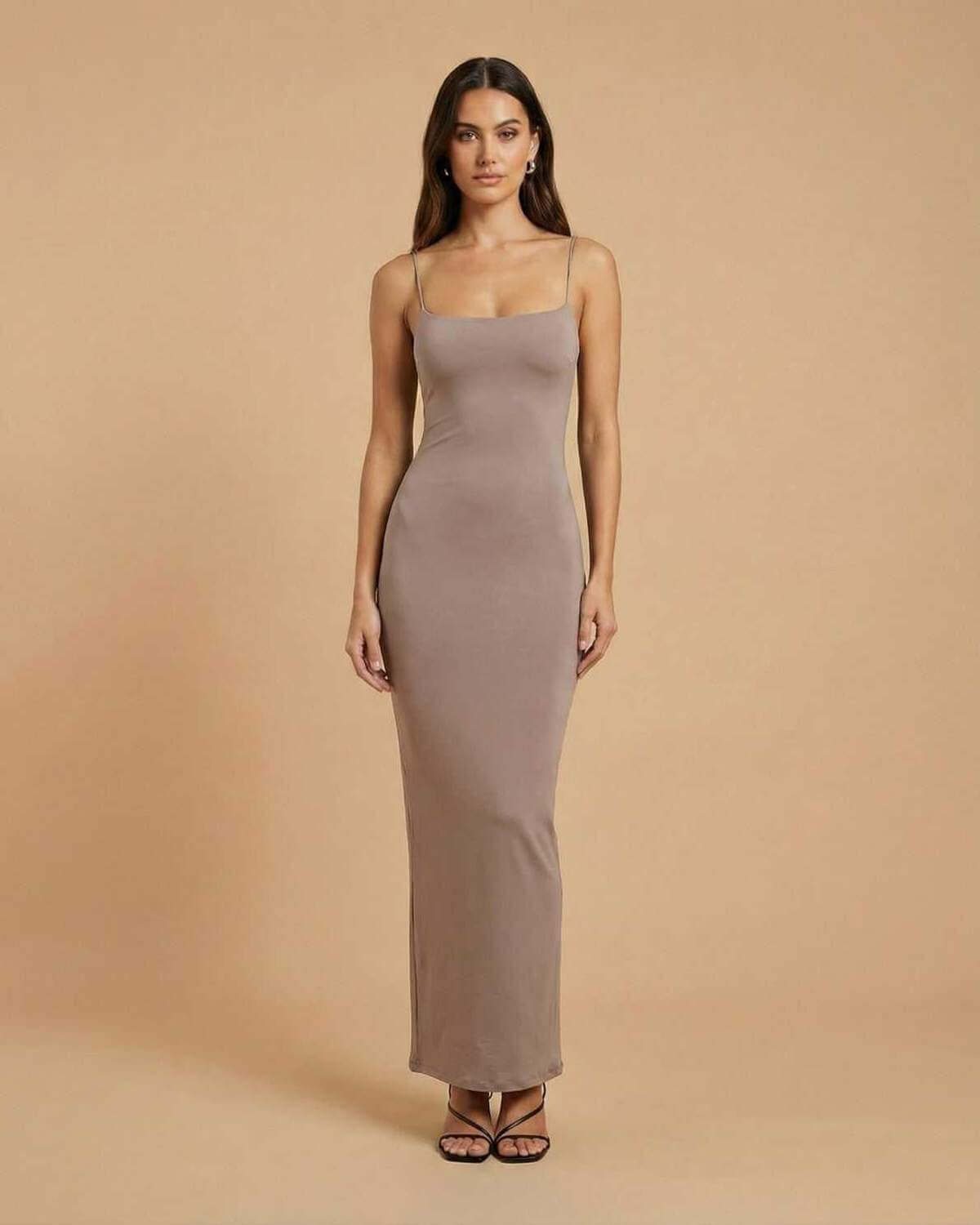 Sahara Maxi Dress by SLIMONA in soft taupe hue with a minimal backless design and delicate spaghetti straps.