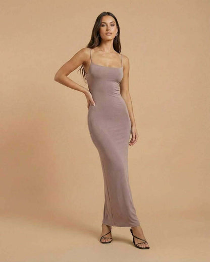 Sahara Maxi Dress by SLIMONA, taupe maxi dress featuring delicate spaghetti straps and minimal backless design.