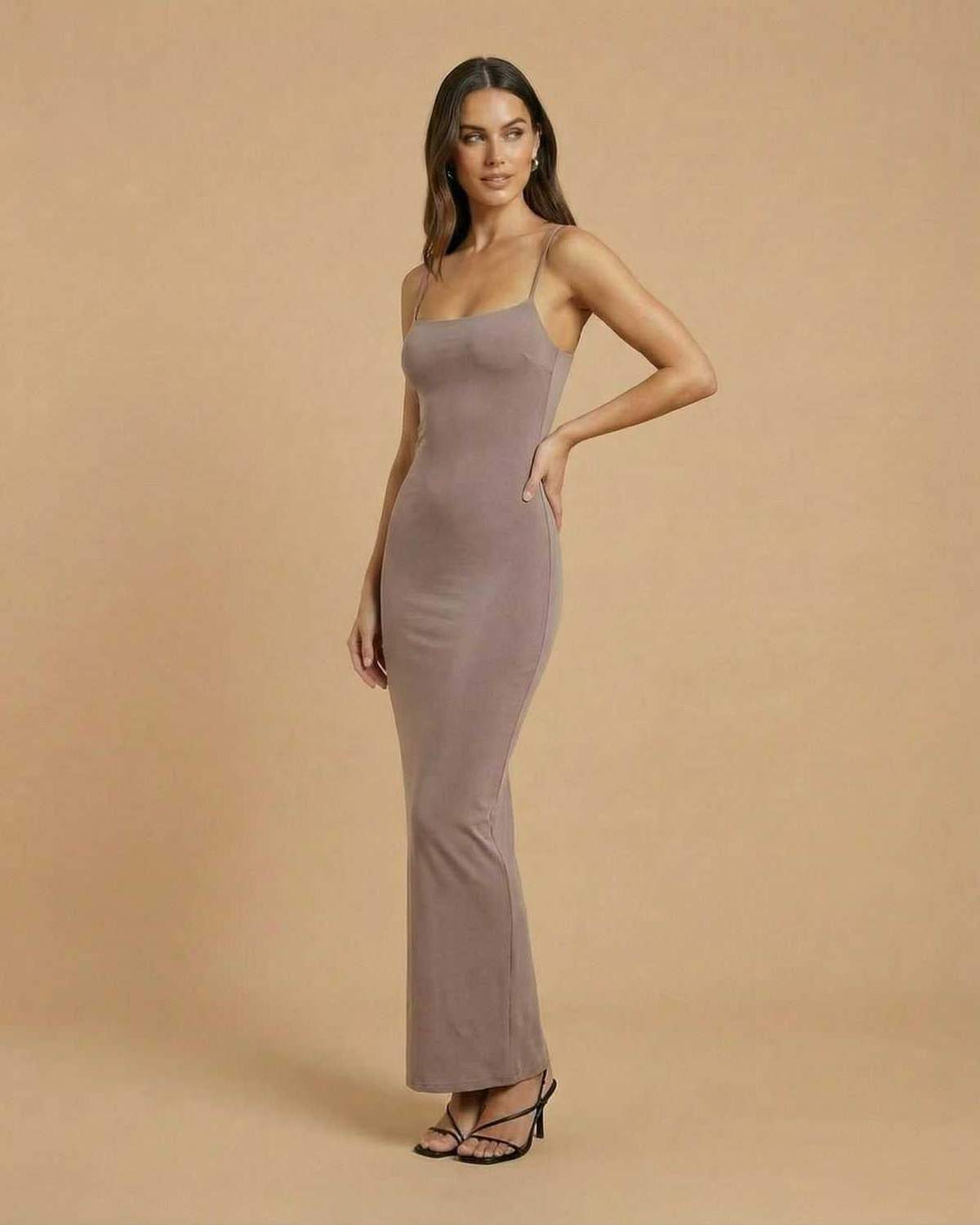 Sahara Maxi Dress by SLIMONA in soft taupe, showcasing a sleek backless design and elegant silhouette.