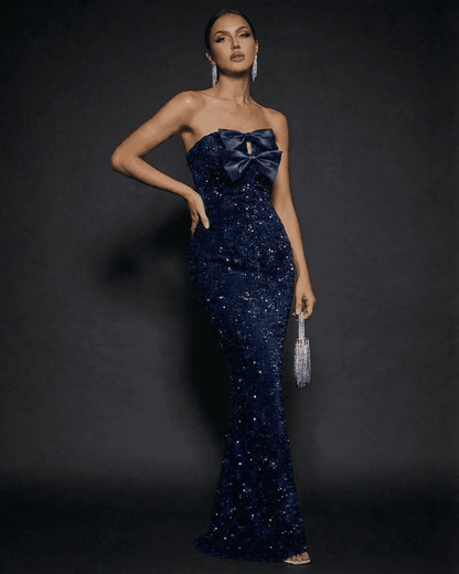 Sapphire Maxi Dress by SLIMONA, strapless sequin party dress with satin bow, showcasing modern elegance.