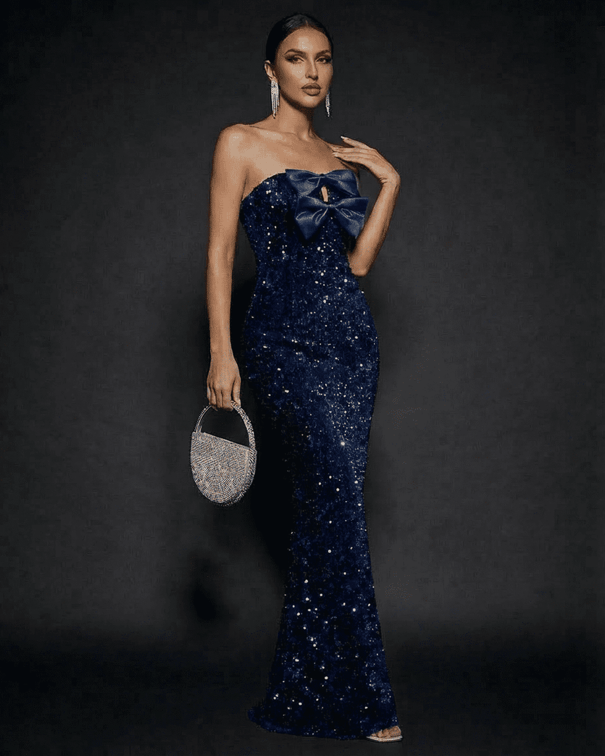 Sapphire Maxi Dress by SLIMONA, glamorous strapless design with sequins and a satin bow for an elegant party look.