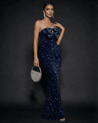 Sapphire Maxi Dress by SLIMONA, glamorous strapless design with sequins and a satin bow for an elegant party look.