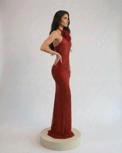Scarlet Maxi Dress by SLIMONA, featuring a halter neck and floral detail, showcasing a stunning red shimmer finish.