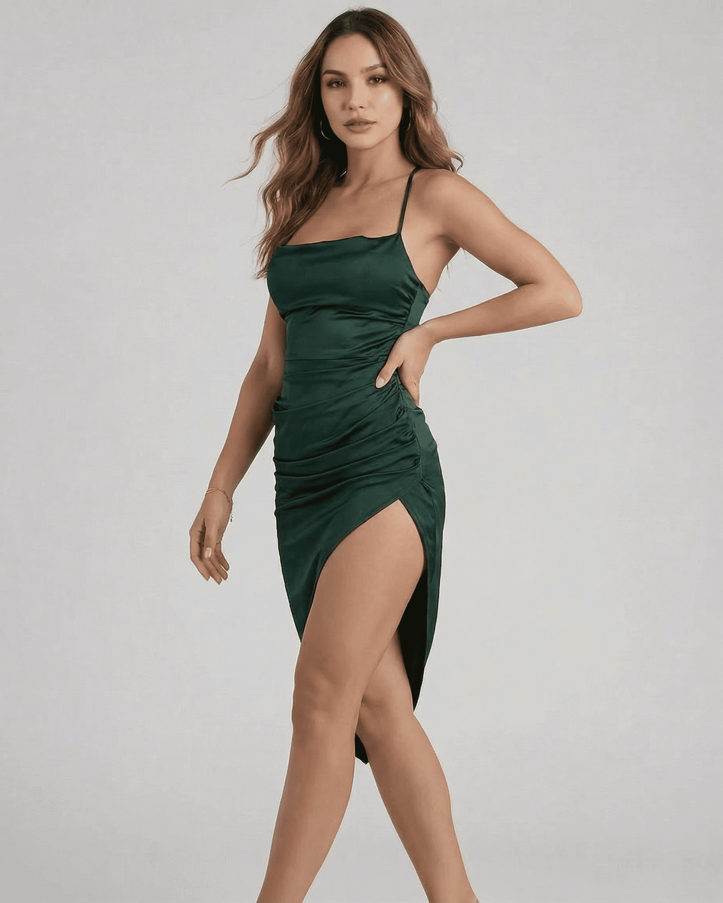 Selene Midi Dress by SLIMONA, featuring a sleek satin silhouette and elegant pleating in a stunning green color.
