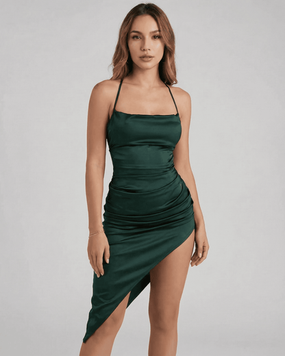Selene Midi Dress by SLIMONA, showcasing a sleek satin silhouette with elegant pleating in rich green.