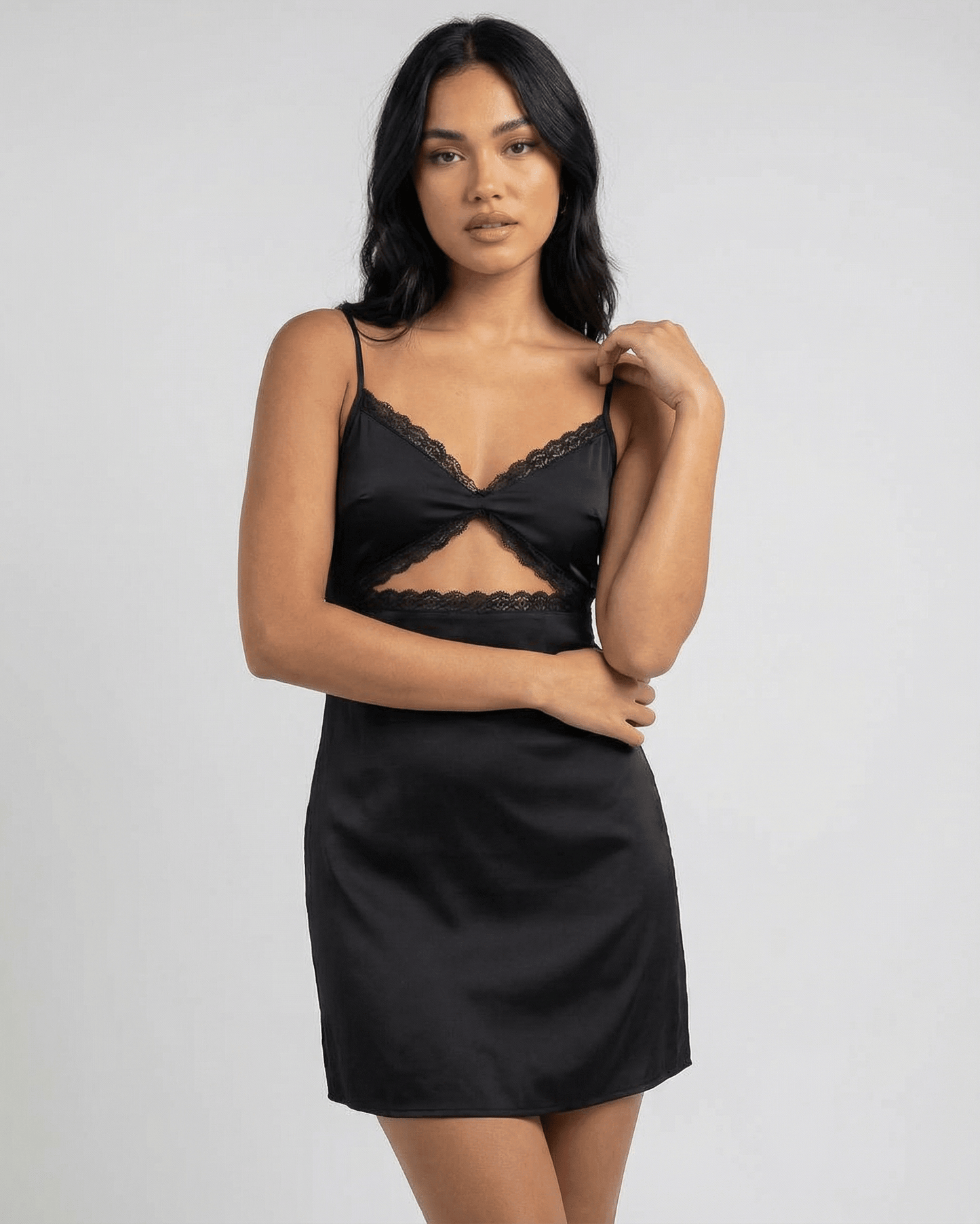 Selene Mini Dress by Lauven featuring lace trim, spaghetti straps, and a sleek black satin-like finish.