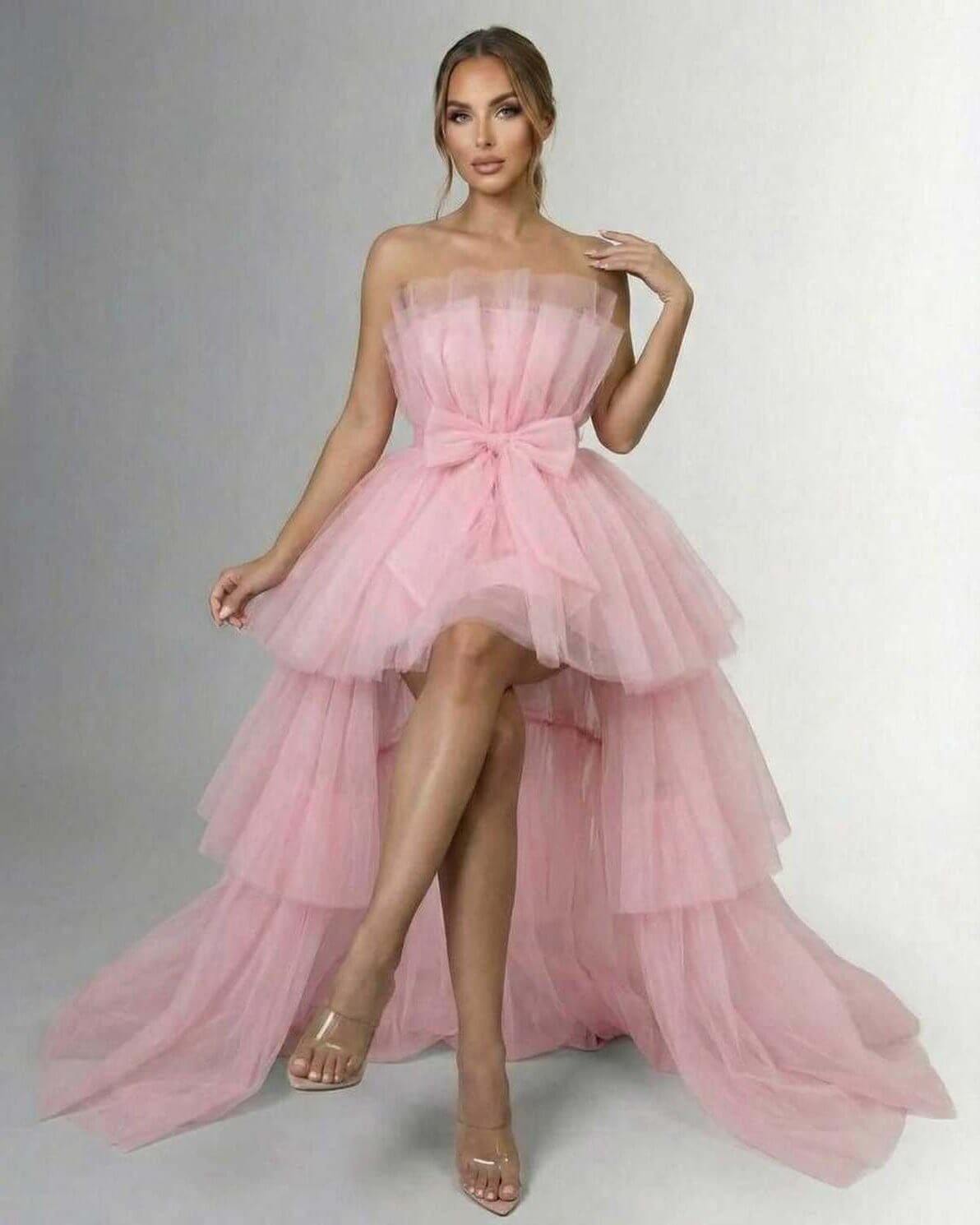 Seraphina Maxi Dress by Lauven – Strapless pink tulle gown with high-low hem and bow accent.