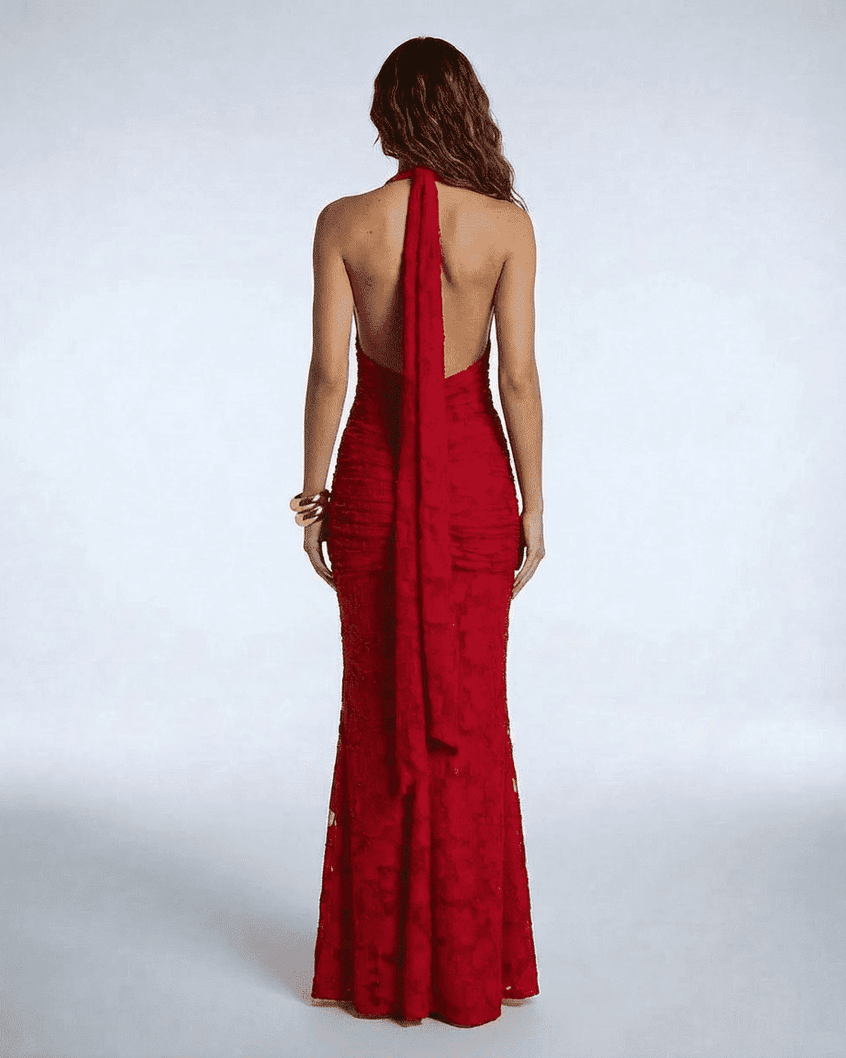 Back view of the Seraphina Maxi Dress by SLIMONA, showcasing its elegant ribbon tie and flattering mermaid silhouette.