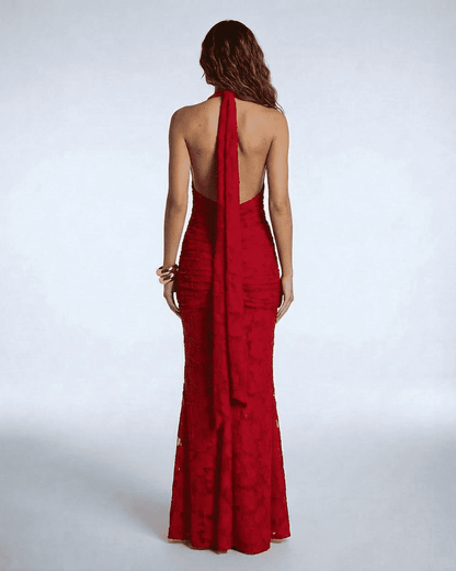 Back view of the Seraphina Maxi Dress by SLIMONA, showcasing its elegant ribbon tie and flattering mermaid silhouette.