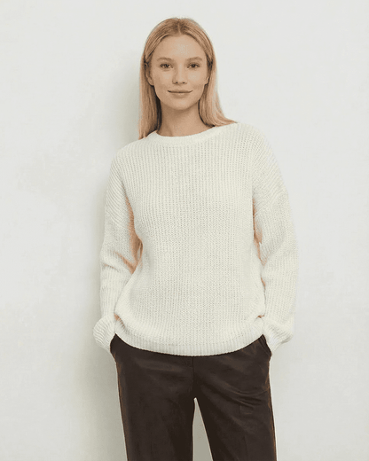 Seren Sweater in ivory by SLIMONA, featuring loose fit, thick ribbed knit, and round neck, perfect for cozy weather.